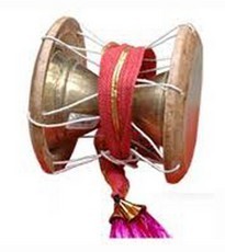 The udukai or uduku is a membranophone instrument used in folk music and prayers in Tamil Nadu and it is originated as well. Its shape is similar to other Indian hourglass drums, having a small snare stretched over one side. The udaku is played with the hand and the pitch may be altered by squeezing the lacing in the middle. The damru in the hands of Lord Shiva is also referred to as udukai.